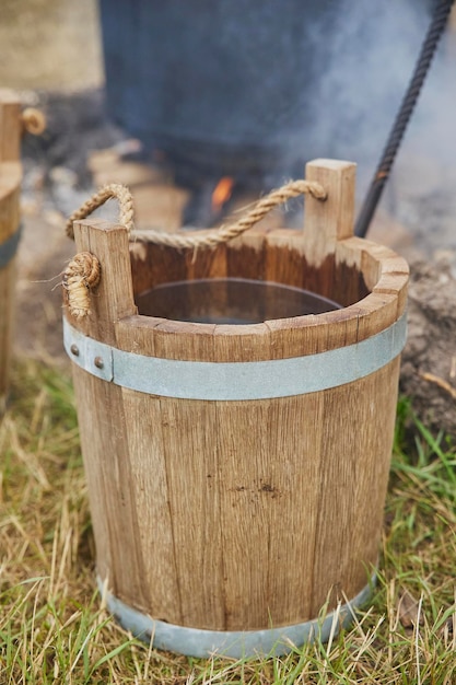 Photo antique wooden bucket at the viking festival in denmark