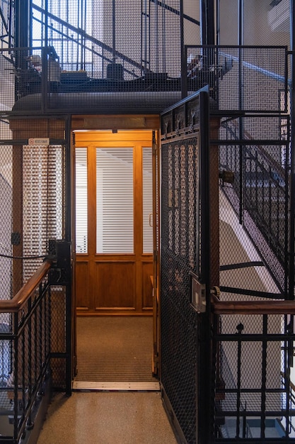 Antique wooden Elevator in a Metal Shaft