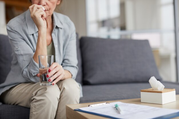 Anxious Mature Woman Drinking Water