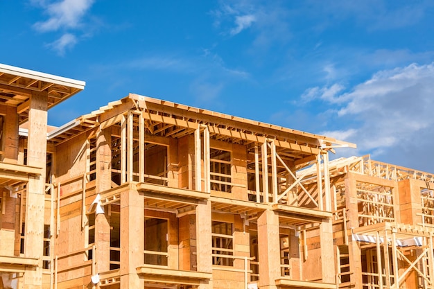 Apartment building under construction on bright sunny day on blue sky background