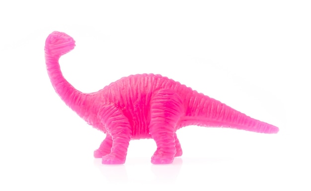 Photo apatosaurus made out of plastic. dinosaur toy isolated on white background