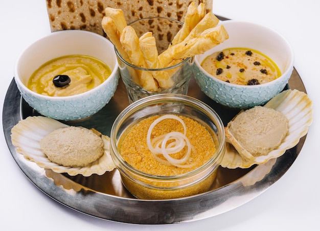 aperitif with hummus mincemeat and pike caviar