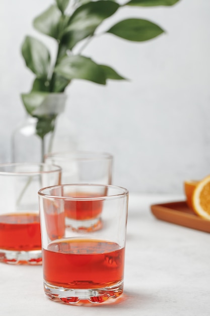 Aperol spritz cocktail in glass with oranges. Summer italian fresh alcohol cold drink