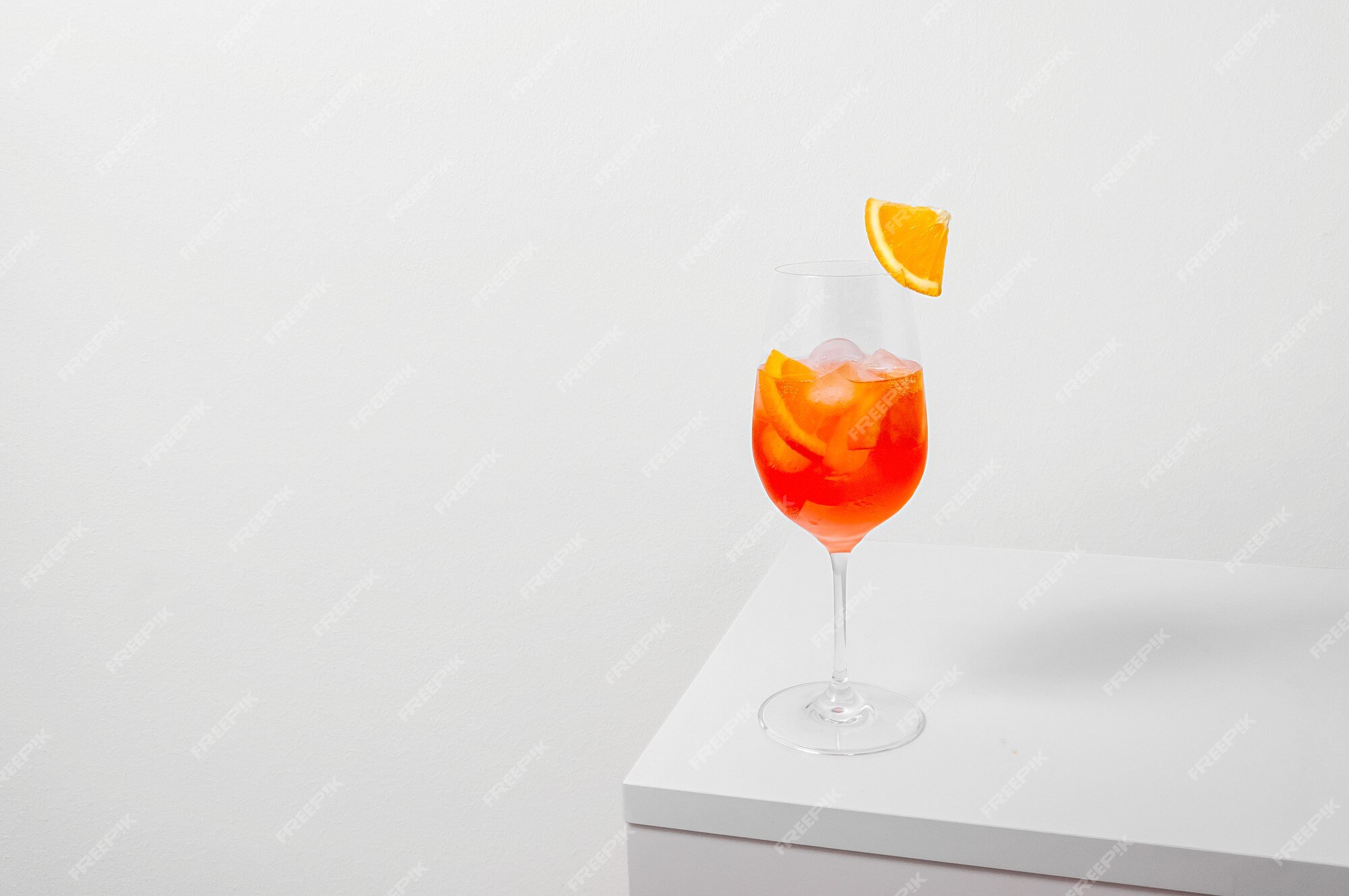 Aperol spritz cocktail in glass with ice and slice