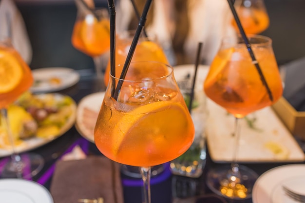 Aperol spritz cocktail with pomelo on the table in restaurant