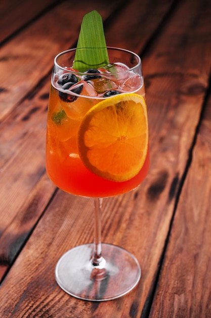 Aperol Spritz with ice on the table close up