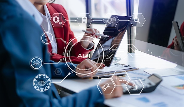 api application programming interface woman using laptop tablet and smartphone with virtual screen api icon software development tool modern technology and networking concept