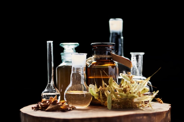 Apothecary vintage set of bottles with fluids and herbs