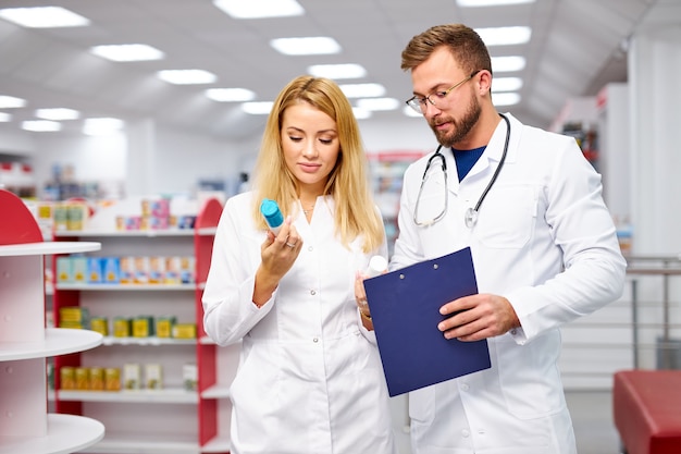 Appealing two caucasian pharmacists communicating