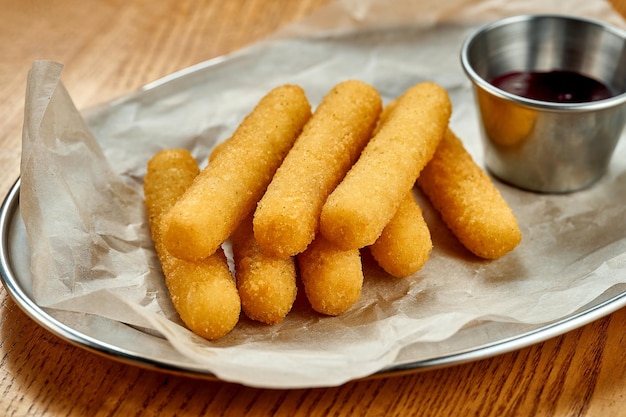 An appetizer for beer breaded stick mozzarella fries Closeup selective focus