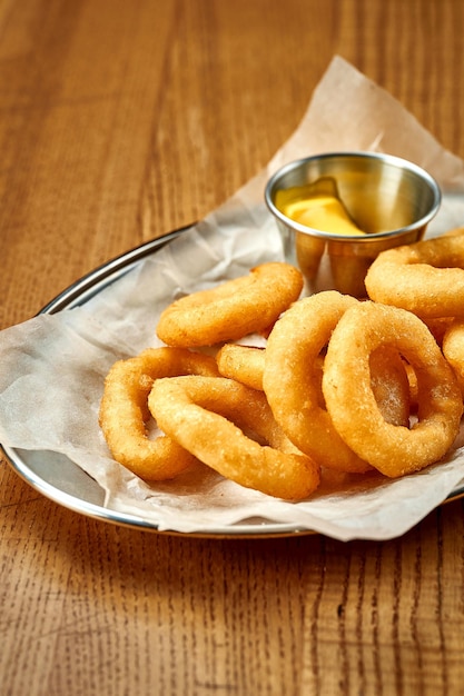 An appetizer for beer onion rings fries Closeup selective focus