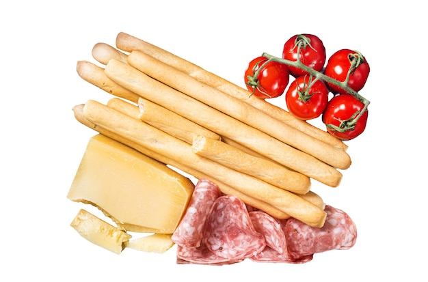 グリッシニのパンの棒とサラミのトマトとパルメザンチーズの前食皿 隔離された白い背景