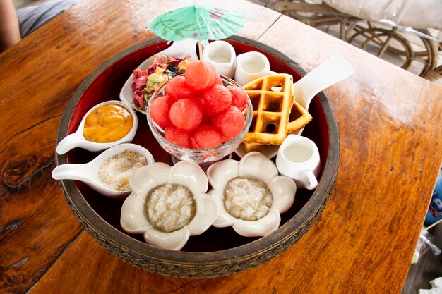 Appetizer thai local snacks sweets food fusion modern luxury style set Watermelon with Sweet Dried Fish Crispy Shallot Dip for serve afternoon tea time of restaurant at resort hotel in Thailand