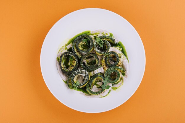 Appetizer twisted into a spiral of zucchini