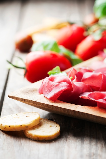 Appetizer with italian bresaola and tomato