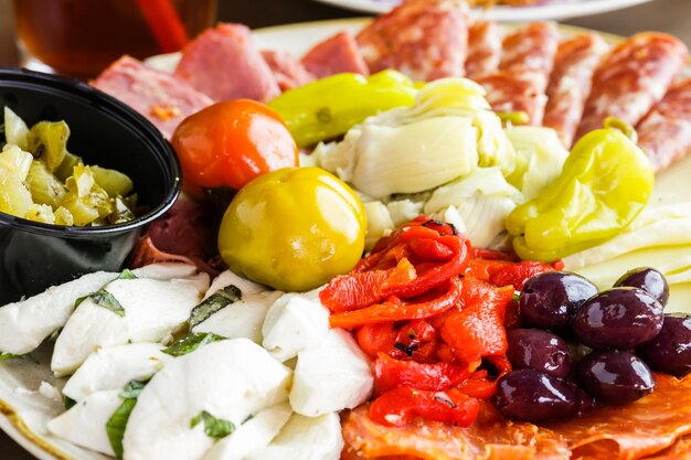 Appetizers plate with antipasto in Italian restaurant.