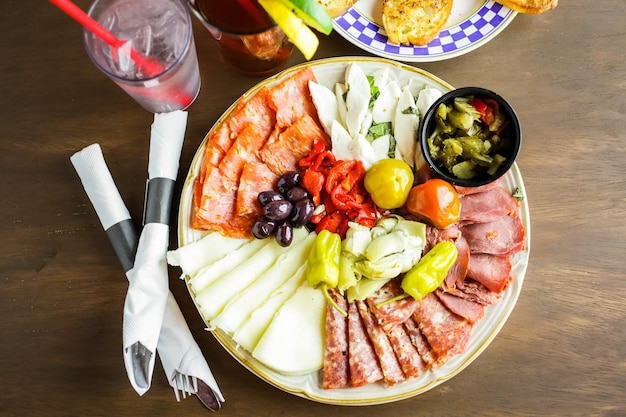 Appetizers plate with antipasto in Italian restaurant.