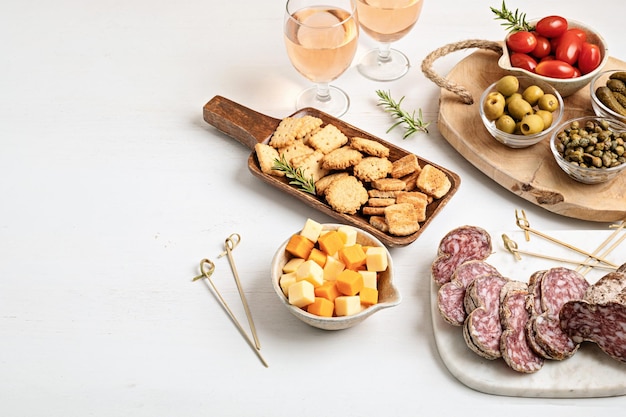 Appetizers table with different antipasti charcuterie snacks cheese