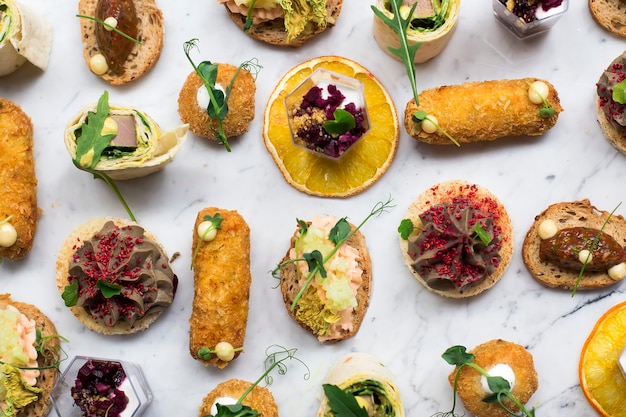 Appetizers table with different antipasti snacks