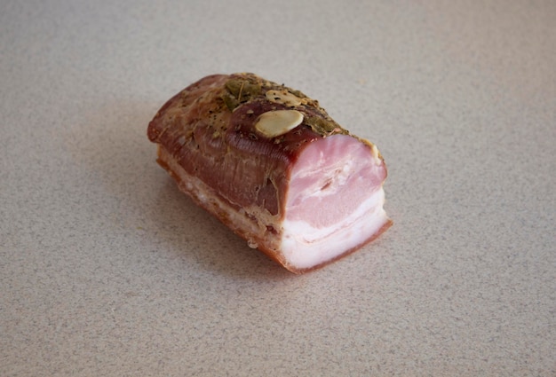 Appetizing baked meat on a marble background closeup