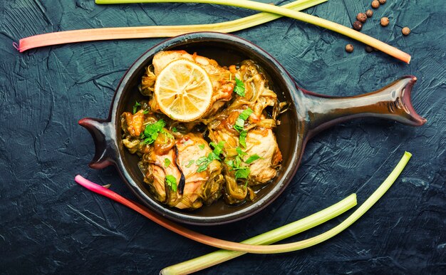 Photo appetizing chicken breast baked with rhubarb