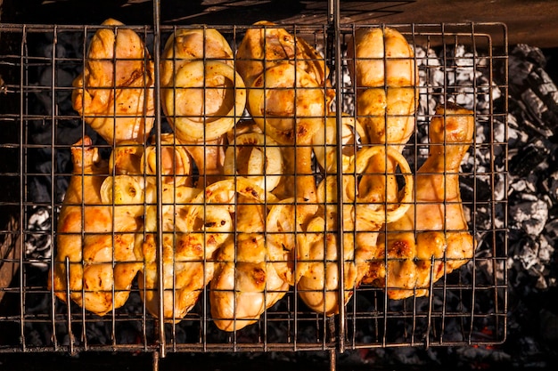 Appetizing chicken legs on the grillBBQ