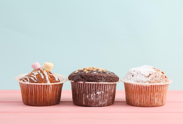 appetizing cupcakes on a pastel background