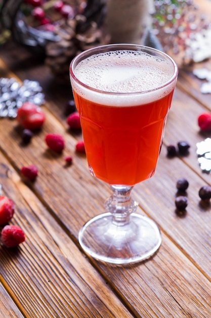 Appetizing drink with strawberries and other berries on the table