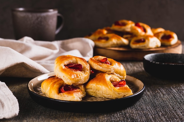 Appetizing envelopes with cheese and pepperoni sausage on a plate on the table