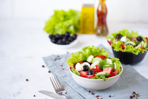 Appetizing greek salad in a plate on a served table