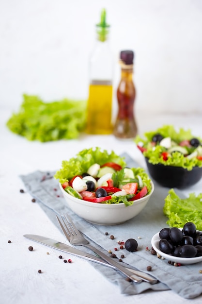 Appetizing greek salad in a plate on a served table