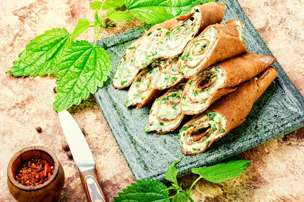 Appetizing liver pancakes stuffed with herbs, cheese, garlic and mayonnaise.Meat pancakes.