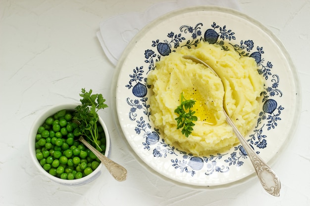 Appetizing mashed potatoes with butter and parsley. Rustic style.