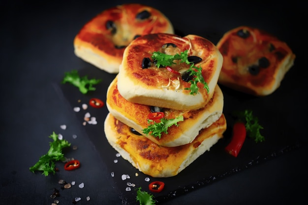 Appetizing mini pizza presentation on a stone board