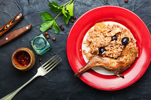 Appetizing pilaf with stewed rabbit.Risotto with a hare.