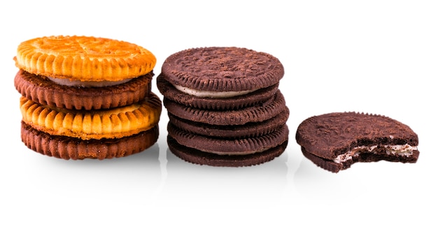 Appetizing round cookies with cream filling on white background.