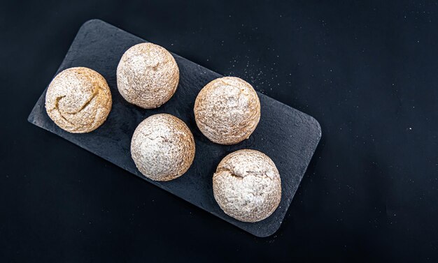 Appetizing shu cakes on a black background