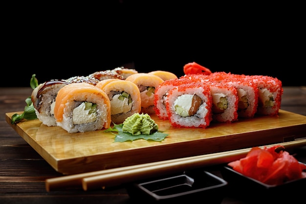 Appetizing sushi rolls in assortment Soy sauce ginger