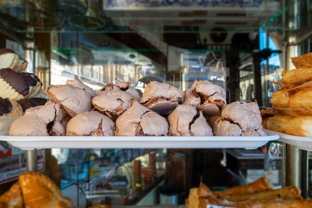 Appetizing sweets dipped in chocolate in a patisserie