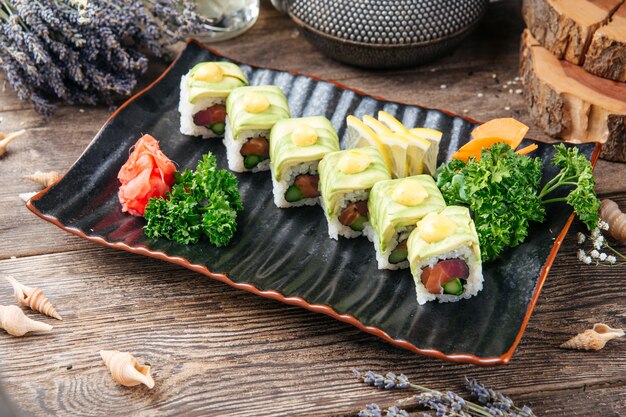 Appetizing tuna and avocado slices sushi rolls