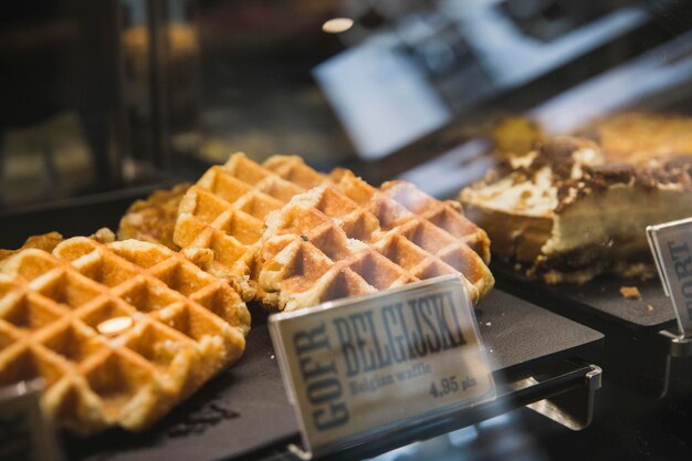 Appetizing waffles on a showcase of a cafe in poland