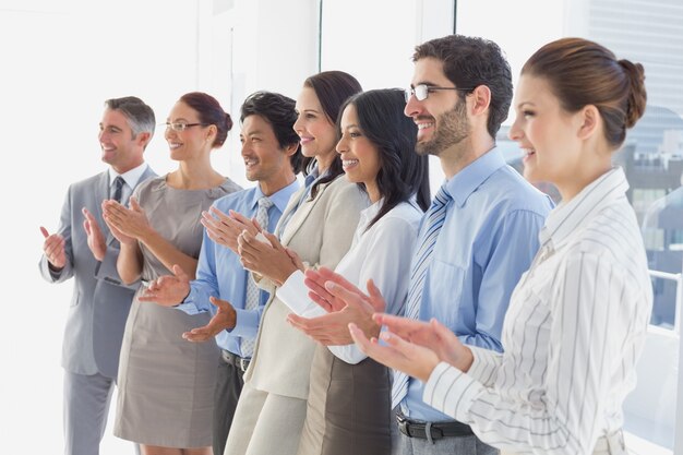 Applauding workers smiling and cheerful