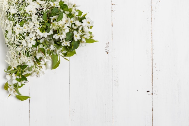 Apple blossom on wooden background. Copy space