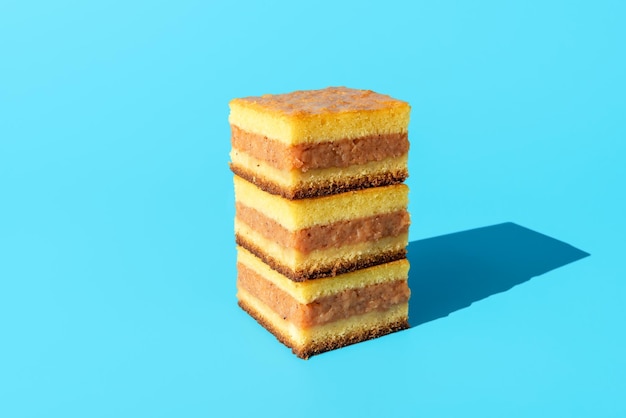 Apple cake slices isolated on a blue background