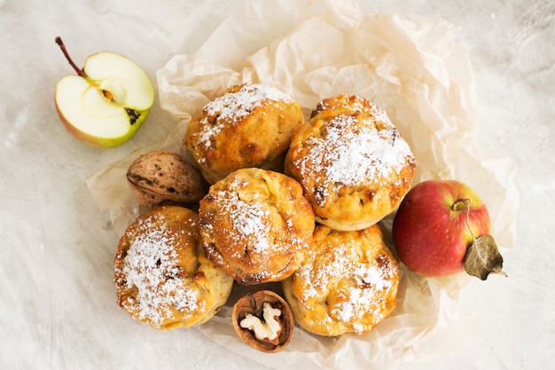 Apple cupcakes over wooden table