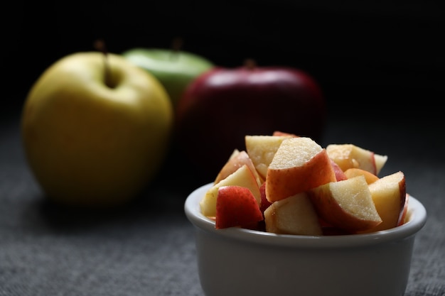 Photo apple cut in a pot on the table