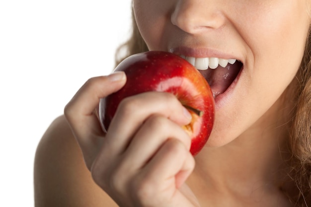 Apple eating biting fruit red apple isolated nutrition