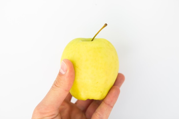 Apple in hand on a white background