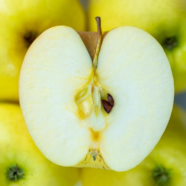 Apple heart cut in half with its seeds visible inside macrophotograph