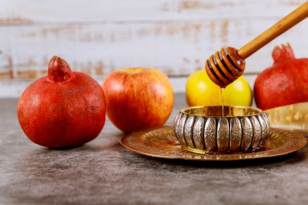 Apple and honey, kosher traditional food of jewish New Year Rosh Hashana shofar